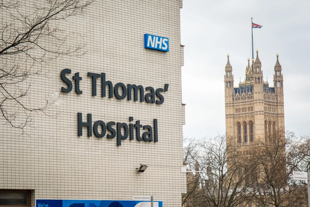 St Thomas’ Hospital building with NHS sign in London.
